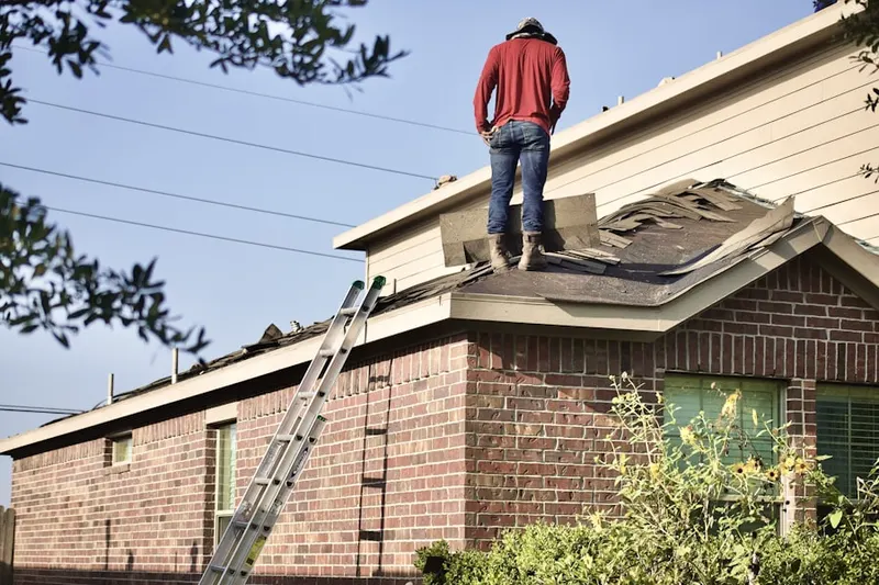 Professional roofer working on a residential roof in Northlake